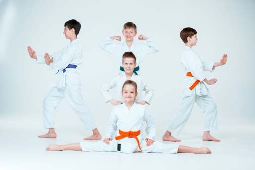 group-of-kids-in-martial-arts-poses-on-a-white-background